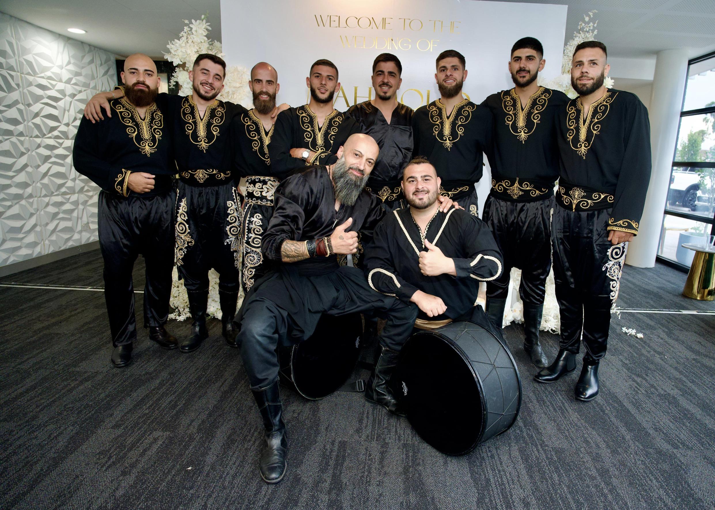 IAMNSA team in black and gold performance costumes