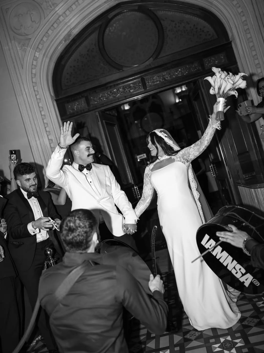 Bride and groom celebrating with IAMNSA at a reception