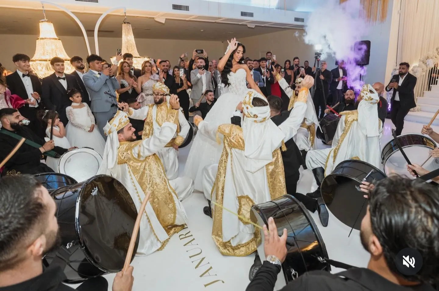 Cultural dancers and drummers filling a wedding dance floor