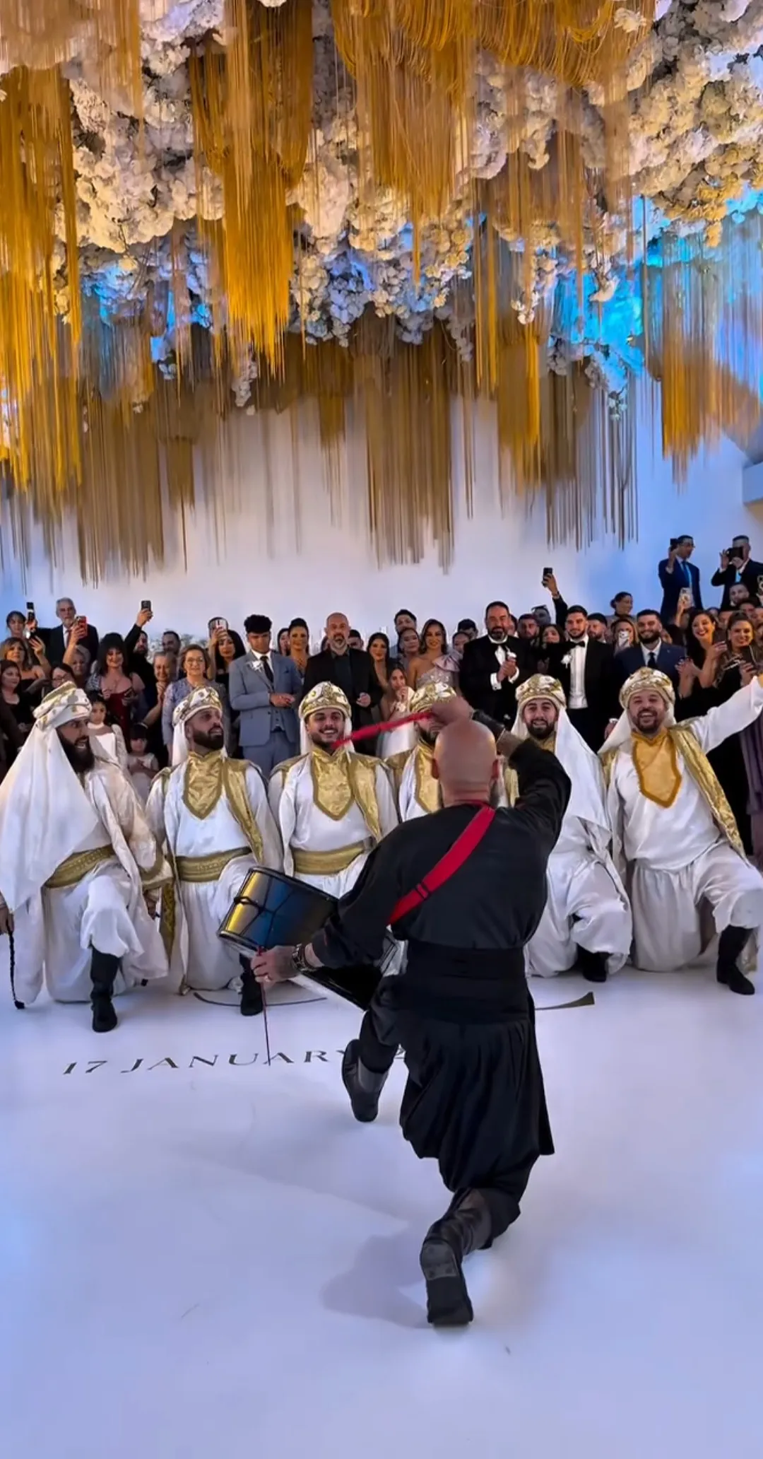 IAMNSA performing with traditional dancers at a wedding