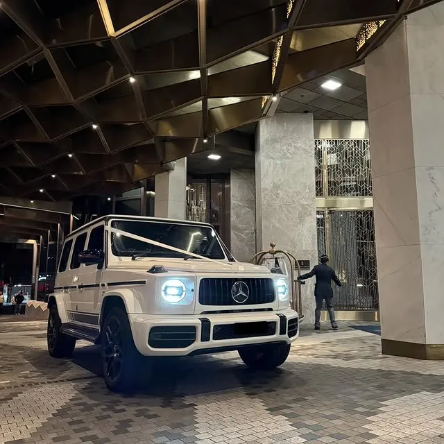White Mercedes G-Wagon parked at an event venue